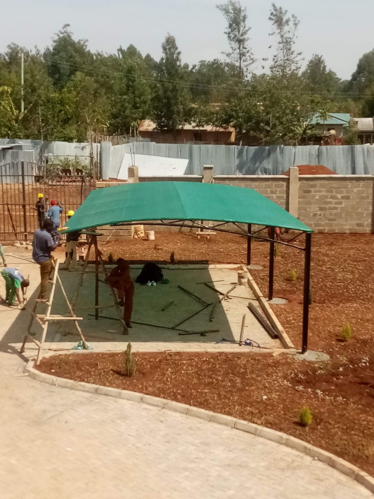 Elatec team installing a car park shade structure