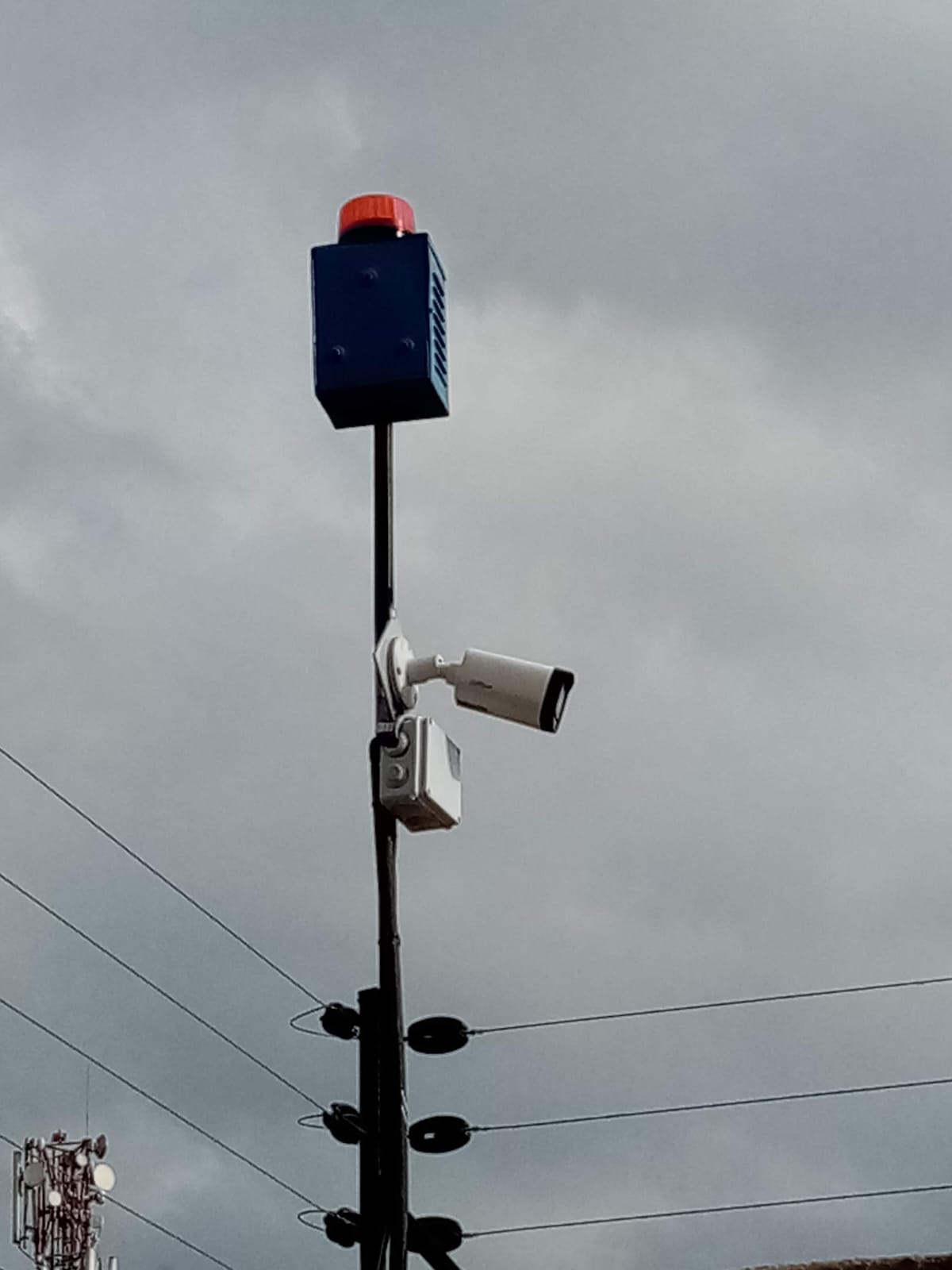 Electric fence energizer siren and CCTV camera combined on a boundary pole at a Limuru apartment complex