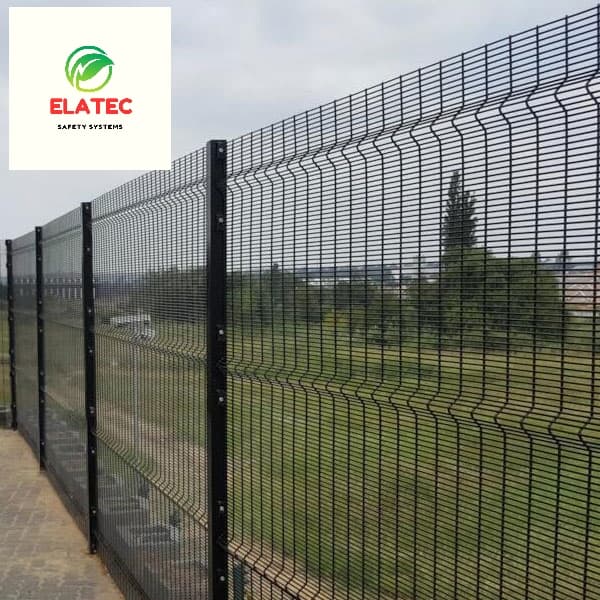 358 anti-climb welded mesh clear view fence panels on powder-coated steel posts along a Karen property boundary, open grounds visible beyond