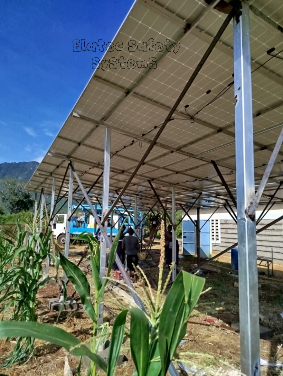 Ground-mounted solar panel array installation in progress