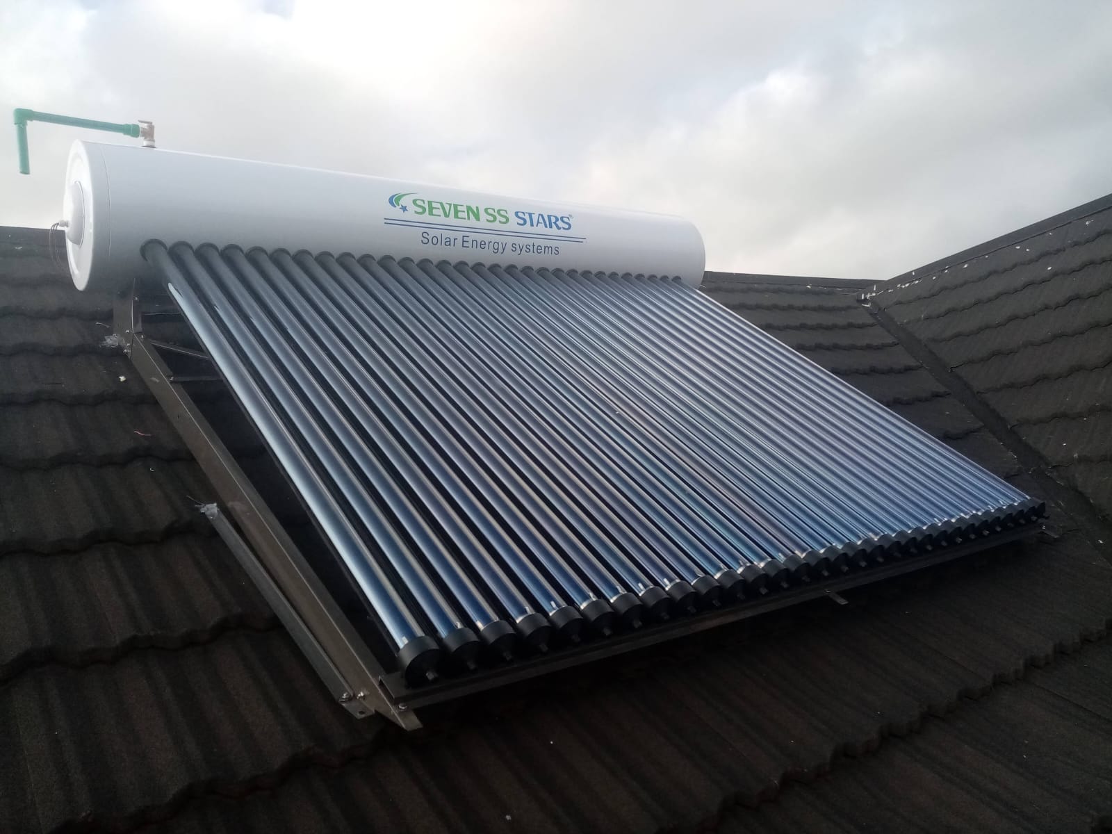 Completed solar water heater installation, tank and collector mounted